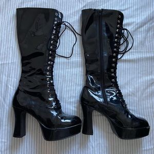 Black vinyl knee-high heeled boots. Size 9